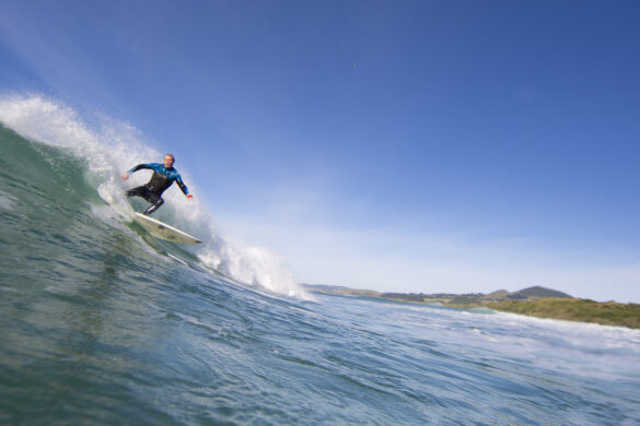 Surfboard manufacturer and shaper Graham Carse surfing at Blackhead,, Dunedin, New Zealand in January 2014.