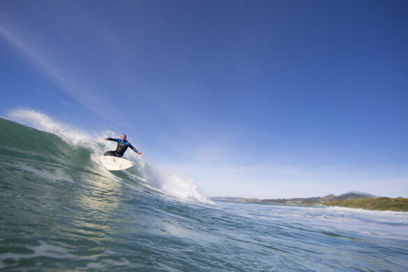 Surfboard manufacturer and shaper Graham Carse surfing at Blackhead,, Dunedin, New Zealand in January 2014.