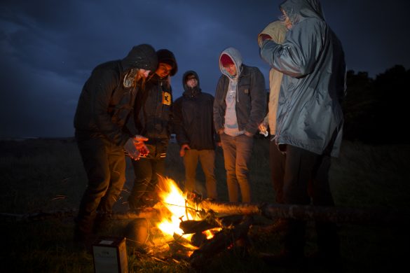 Campfire in the rain at a remote beach in the Catlins. Photo: Derek Morrison