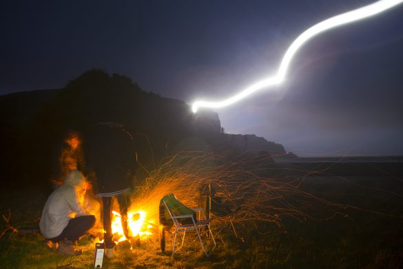 Campfire in the rain at a remote beach in the Catlins. Photo: Derek Morrison