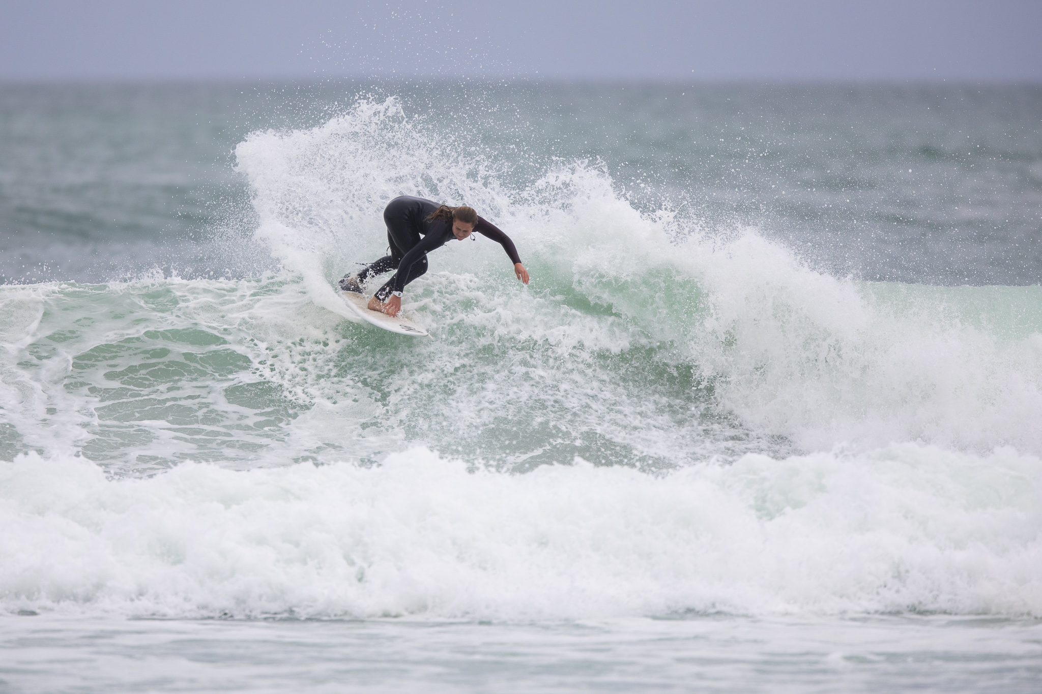 Elin Tawharu got knocked out early but hung around to surf her brains out with her family.
Photo: Derek Morrison