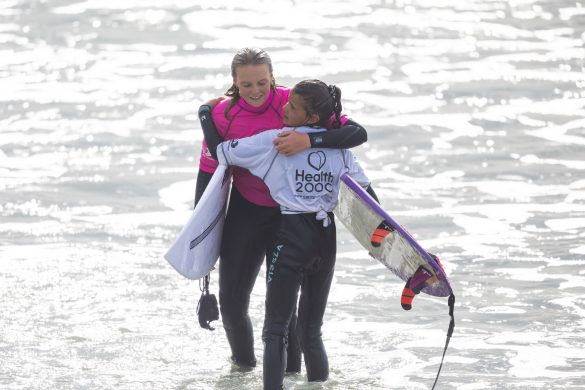 Under 14 Girl's winner Amarnie Barber hugs nine-year-old finalist Poppy Pennington after the final. Photo: Derek Morrison