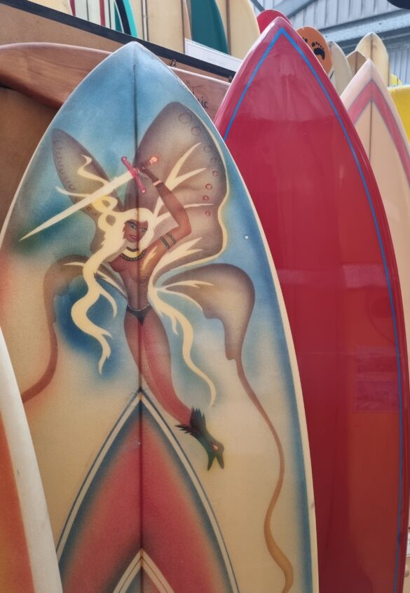 Many of the surfboards have airbrush designs.