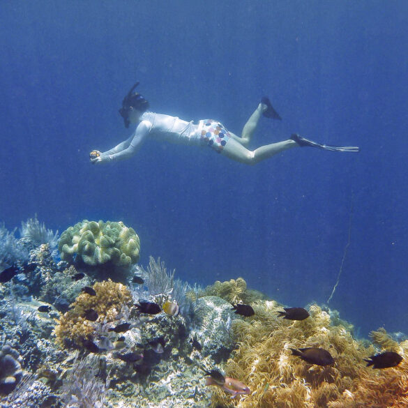 Snorkeling under the surf, Sulawesi, Indonesia. Photo: Lydia Green